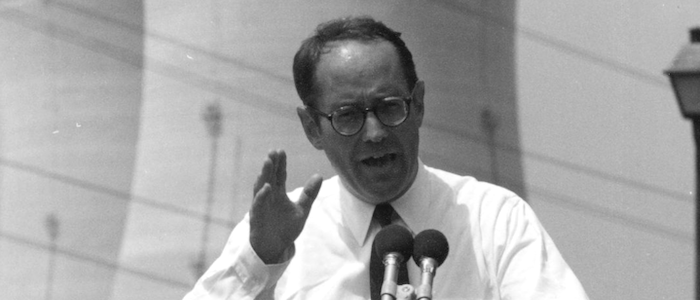 Dick at the podium in front of Three Mile Island